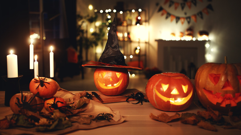 Halloween party, fake spiders jack-o-lanterns