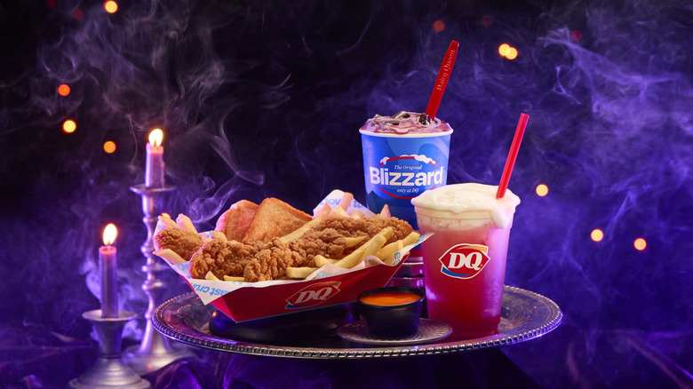 Dairy Queen Enchanted Oreo Blizzard pictured with drink and chicken strip basket on silver tray