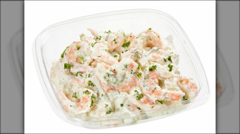 Shrimp salad in a dish on a white background