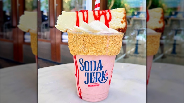 The Big Cheese-Shake topped with slice of cheesecake, whipped cream, and strawberry sauce