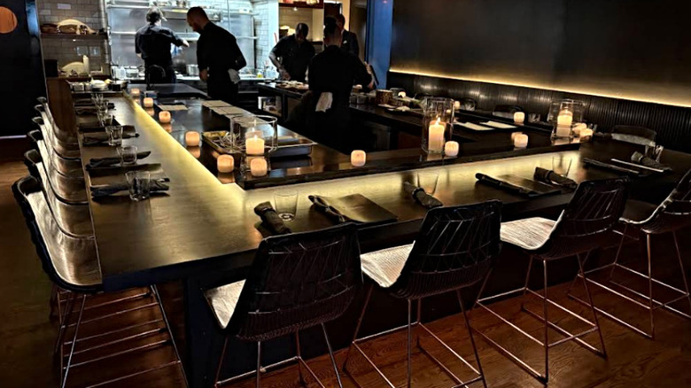 Staff preparing dinner at the chef's counter at Beckon