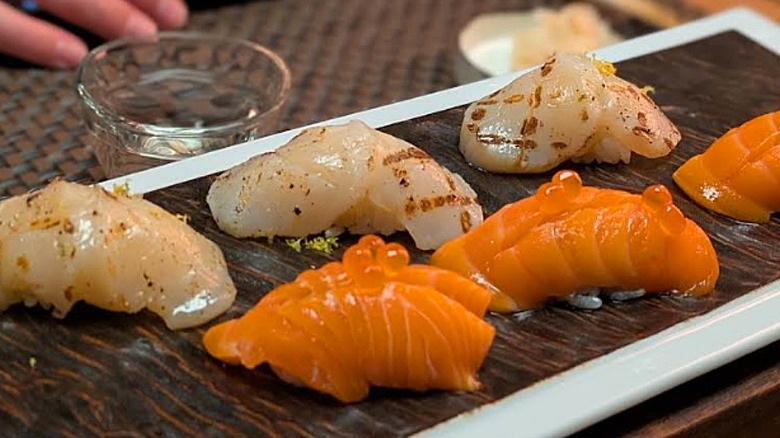 Plated salmon and scallop nigiri