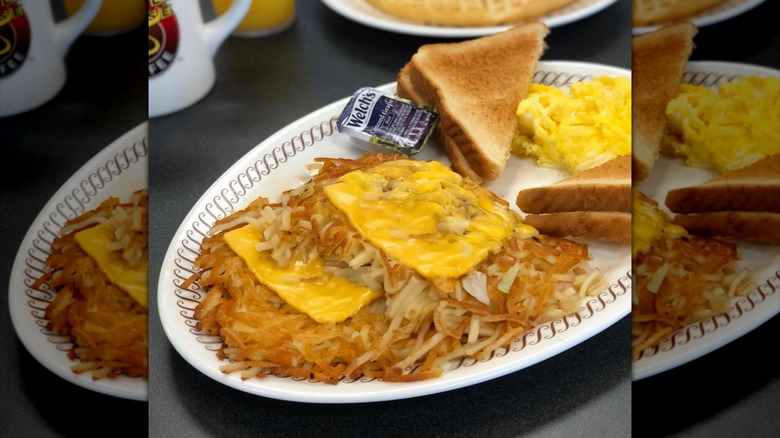 Plate with cheese and onion hash browns, toast, and scrambled eggs from Waffle House