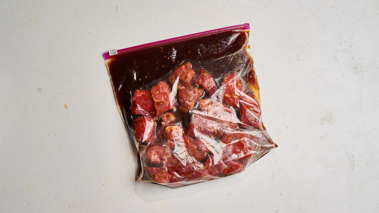 marinating beef in teriyaki marinade in zip-top bag
