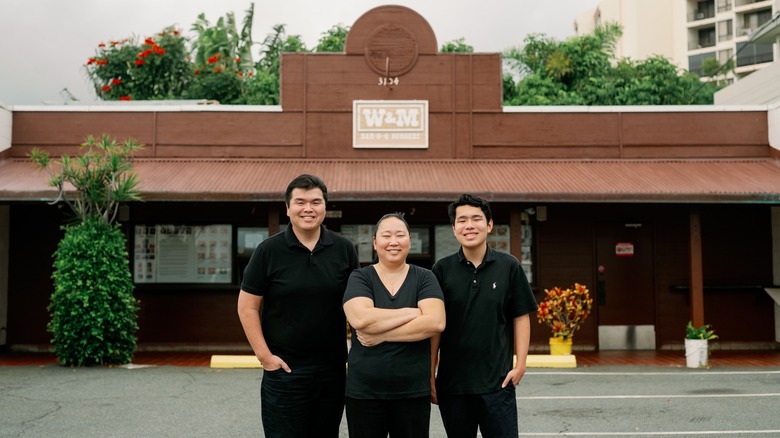 the owners of W&M standing outside the restaurant