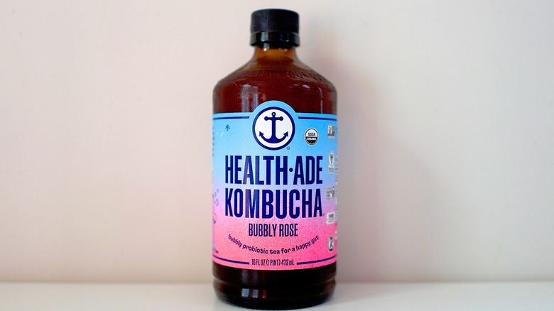Bottle of Health-Ade Bubbly Rose Kombucha on white table