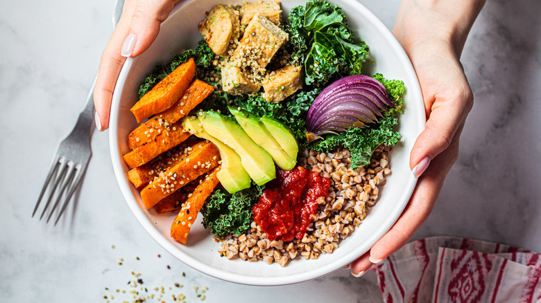 Colorful bowl of fruits, vegetables, and grains