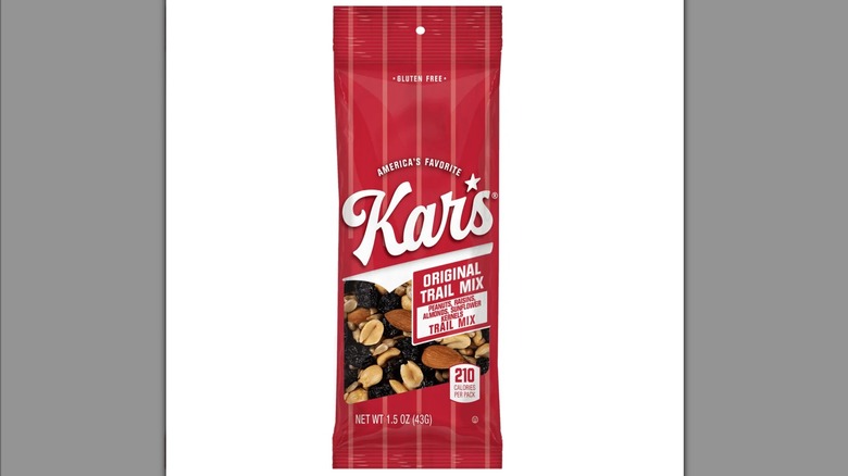 Single-serving sleeve of Kar's Original Trail Mix with image of nuts, seeds, and raisins on front
