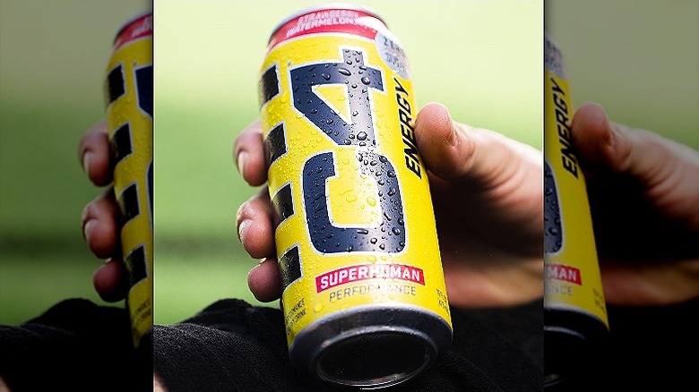 Hand holding a can of C4 energy