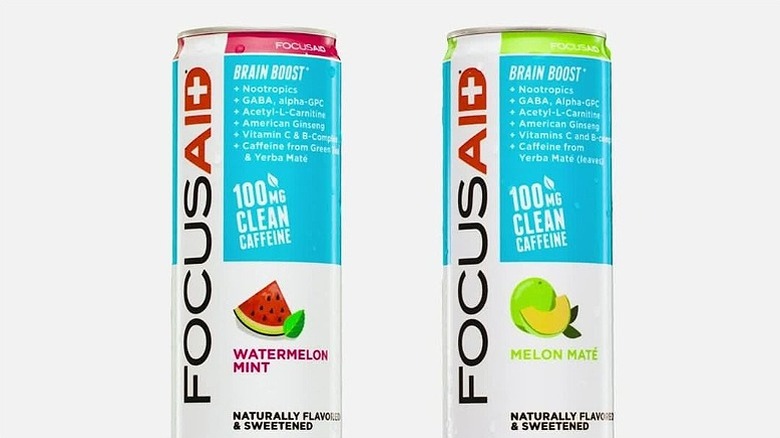 Two cans of FocusAid energy drinks on white background