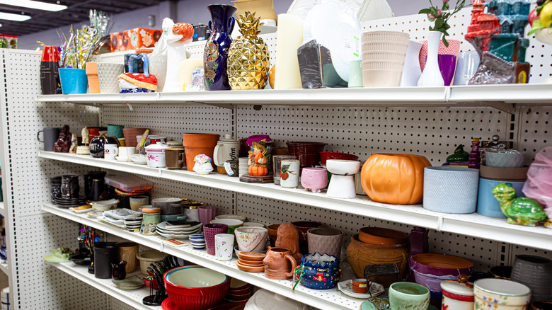 A thrift store with shelves of eclectic crockery