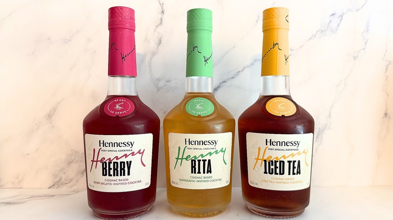 Three bottles of Hennessy Very Special Cocktails on marble background