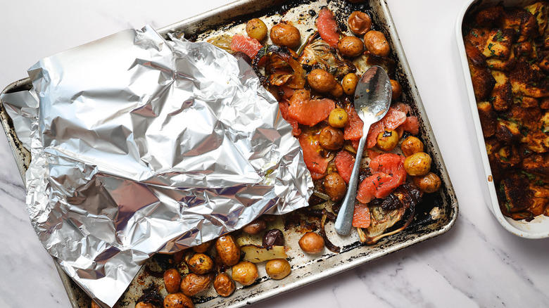 Chicken covered in aluminum foil