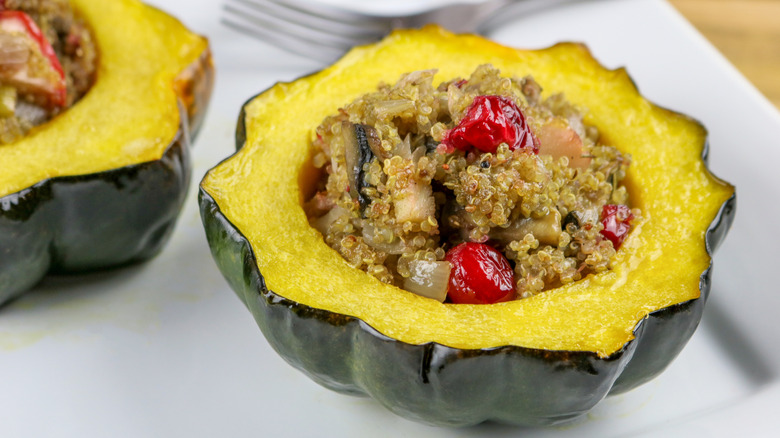 Acorn squash half stuffed with quinoa