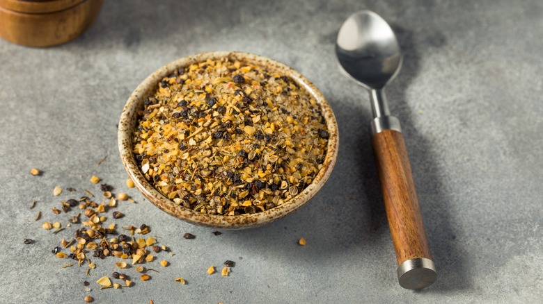 small bowl of dry rub with spoon