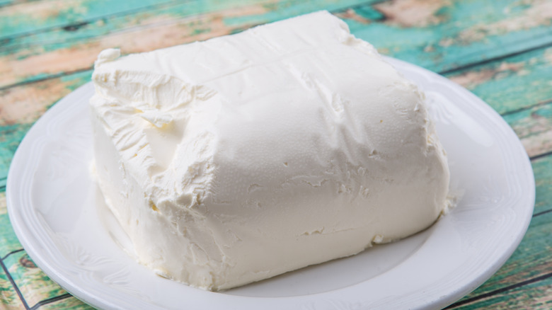 cream cheese block on white plate