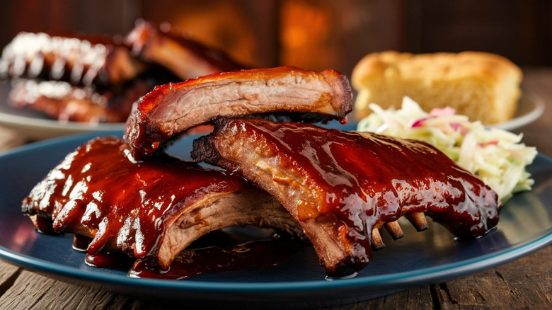Plate of baby back ribs with barbecue sauce