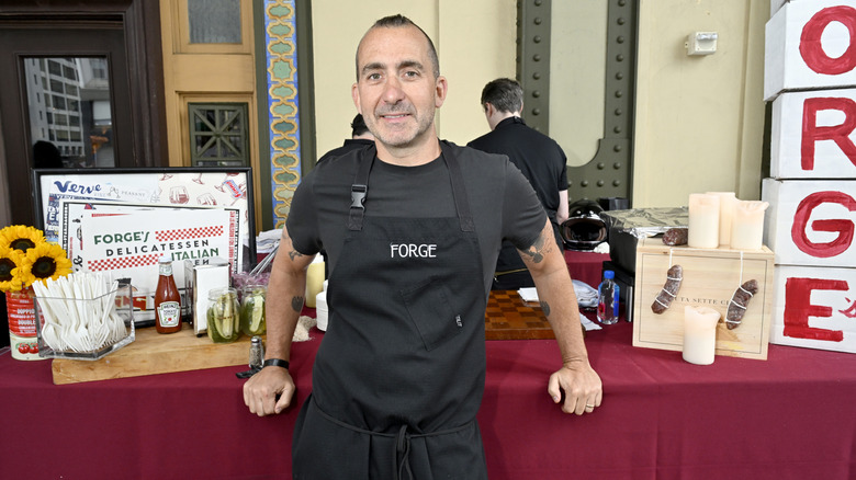 Chef Marc Forgione at food display with pickles