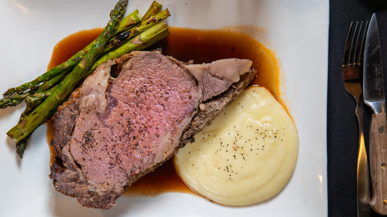 Prime rib dinner with asparagus and mashed potatoes