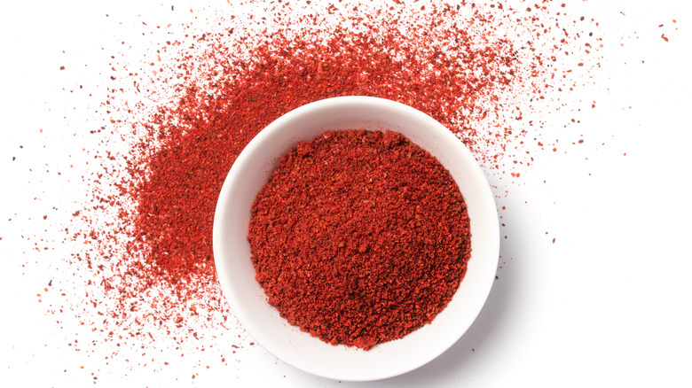 red paprika spice filling bowl