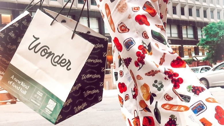 Woman carrying Wonder food bags