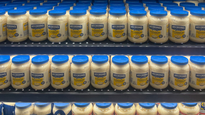 Rows of Hellman's mayonnaise on a store shelf