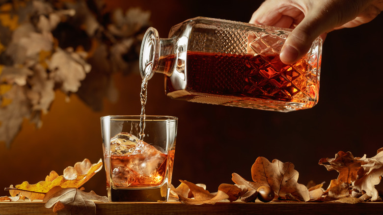 Whisky pouring from a decanter.
