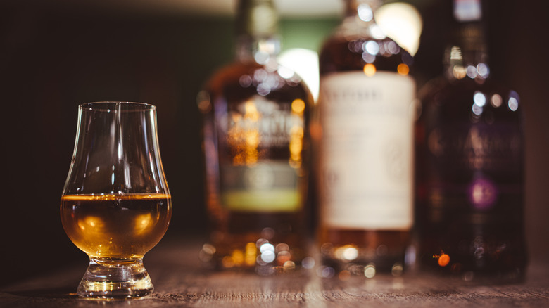 Glencairn glass and whisky bottles.