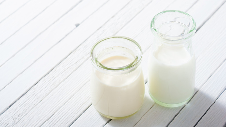 Milk samples on white wood table
