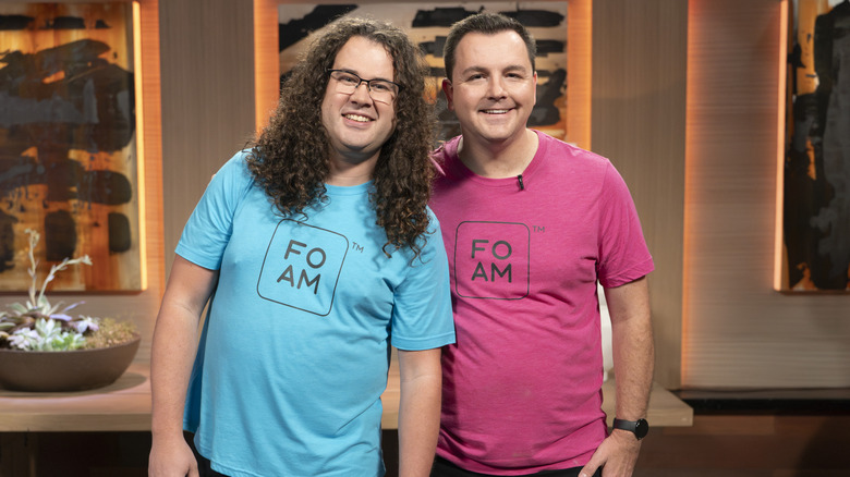 Chad Lee and David Kittle, the men behind FOAM coolers, pose in their brightly colored shirts on the set of "Shark Tank"