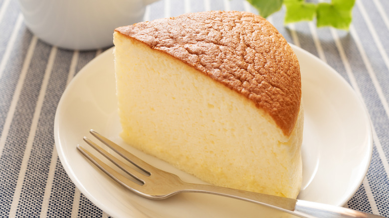 Cake baked in a rice cooker over a white plate