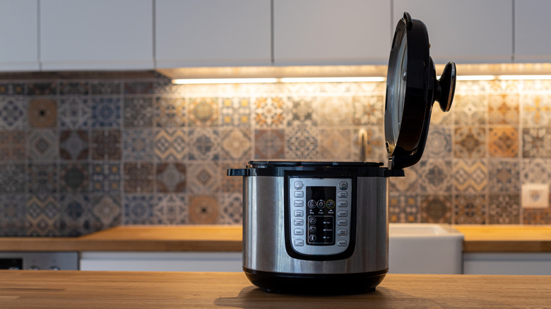An open Instant Pot on a kitchen counter