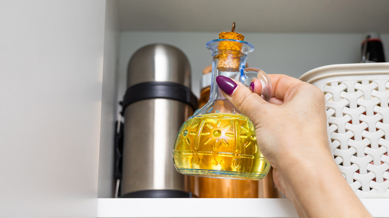 storing oil in a cabinet