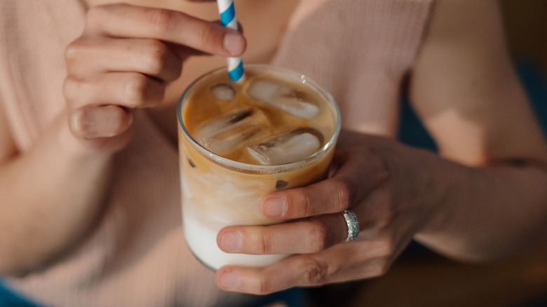 Foodie sipping iced coffee at a cafe
