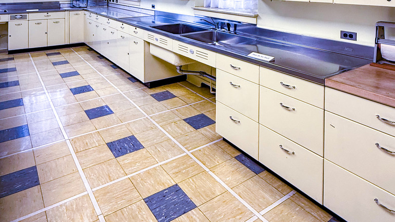 kitchen outfitted with white cabinets