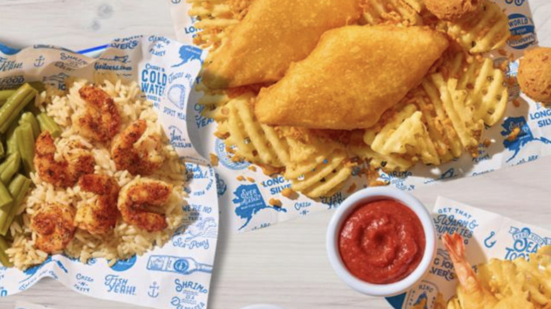 Long John Silver's two piece fish in front of beverage cup