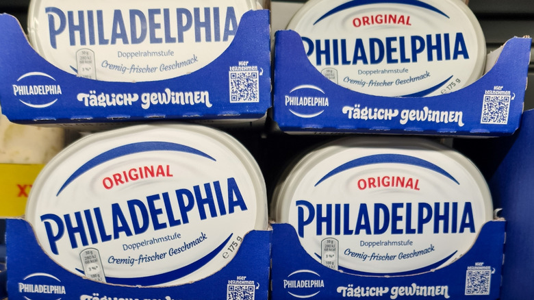 Tubs of Philadelphia cream cheese with German writing