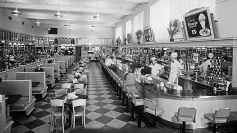 Black and white photo of the lunch counter and dining area of Walgreen's