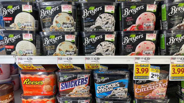 Numerous types of Breyers ice cream in a grocery store display