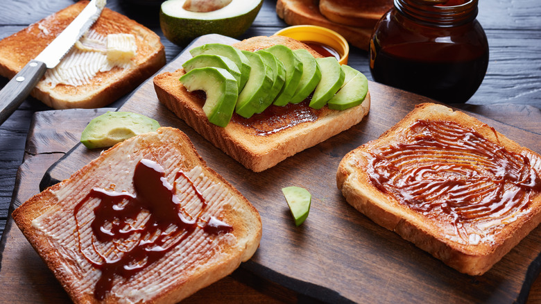 Array of toast with butter, Vegemite, and avocado