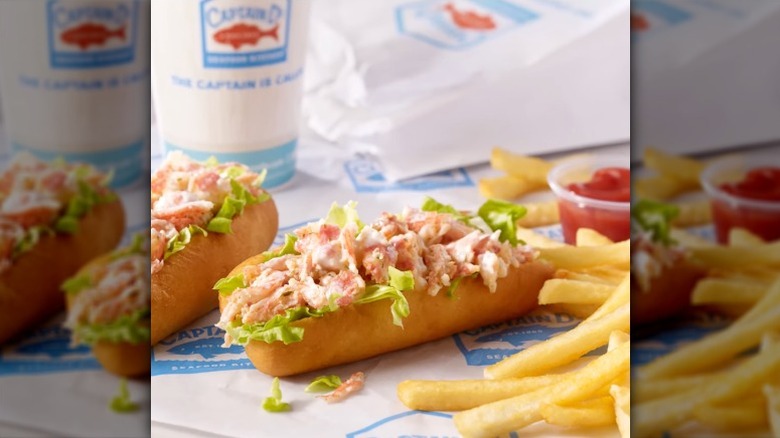 Captain D's lobster rolls on paper beside a drink