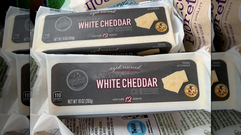 Two blocks of Emporium White Cheddar Cheese