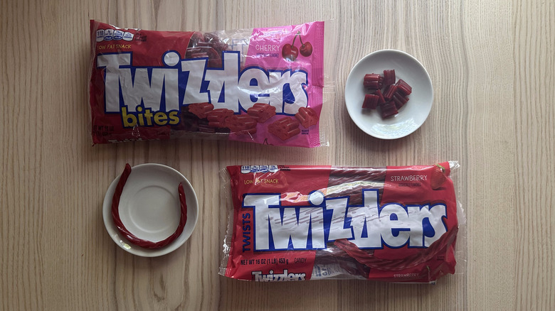 Two bags of Twizzlers on wooden table