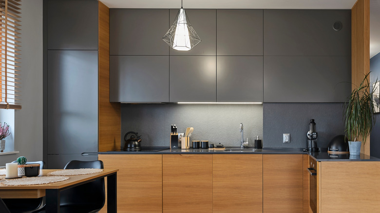 Kitchen with wood and dark gray cabinets