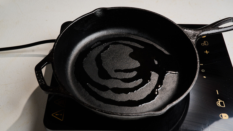 heating oil in a skillet