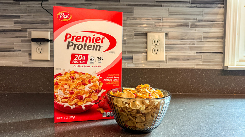 A box and bowl of Premier Protein cereal are shown.