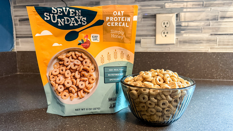 A bag and bowl of Seven Sundays simply honey protein cereal are shown.