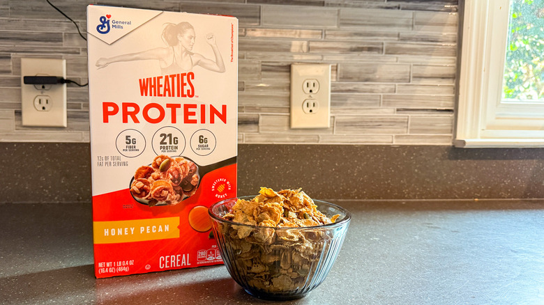A box and bowl of Wheaties Protein cereal are shown.