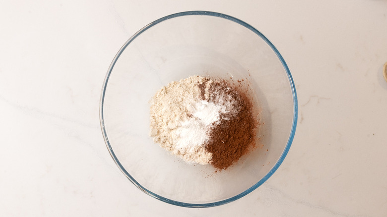 aerial view of glass bowl with dry pancake ingredients