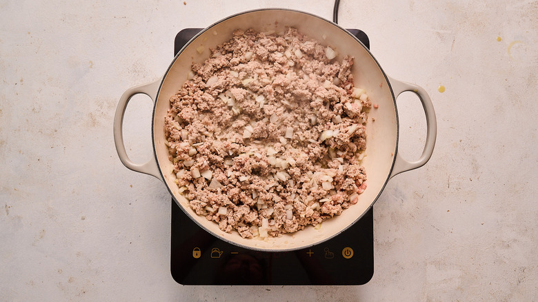 turkey and onions in a skillet
